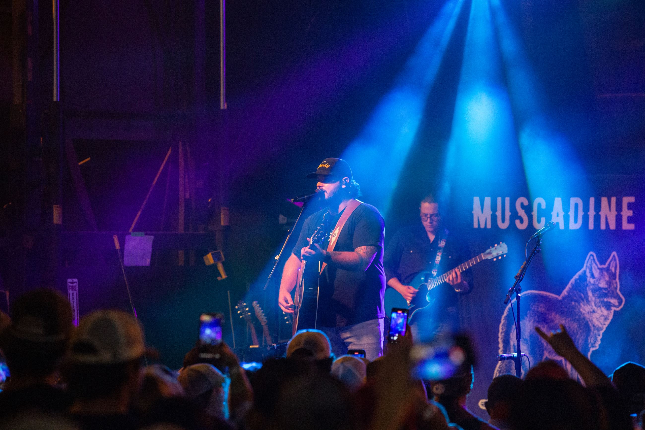 Muscadine Bloodline performs on lighted stage at Rock the Route 2022