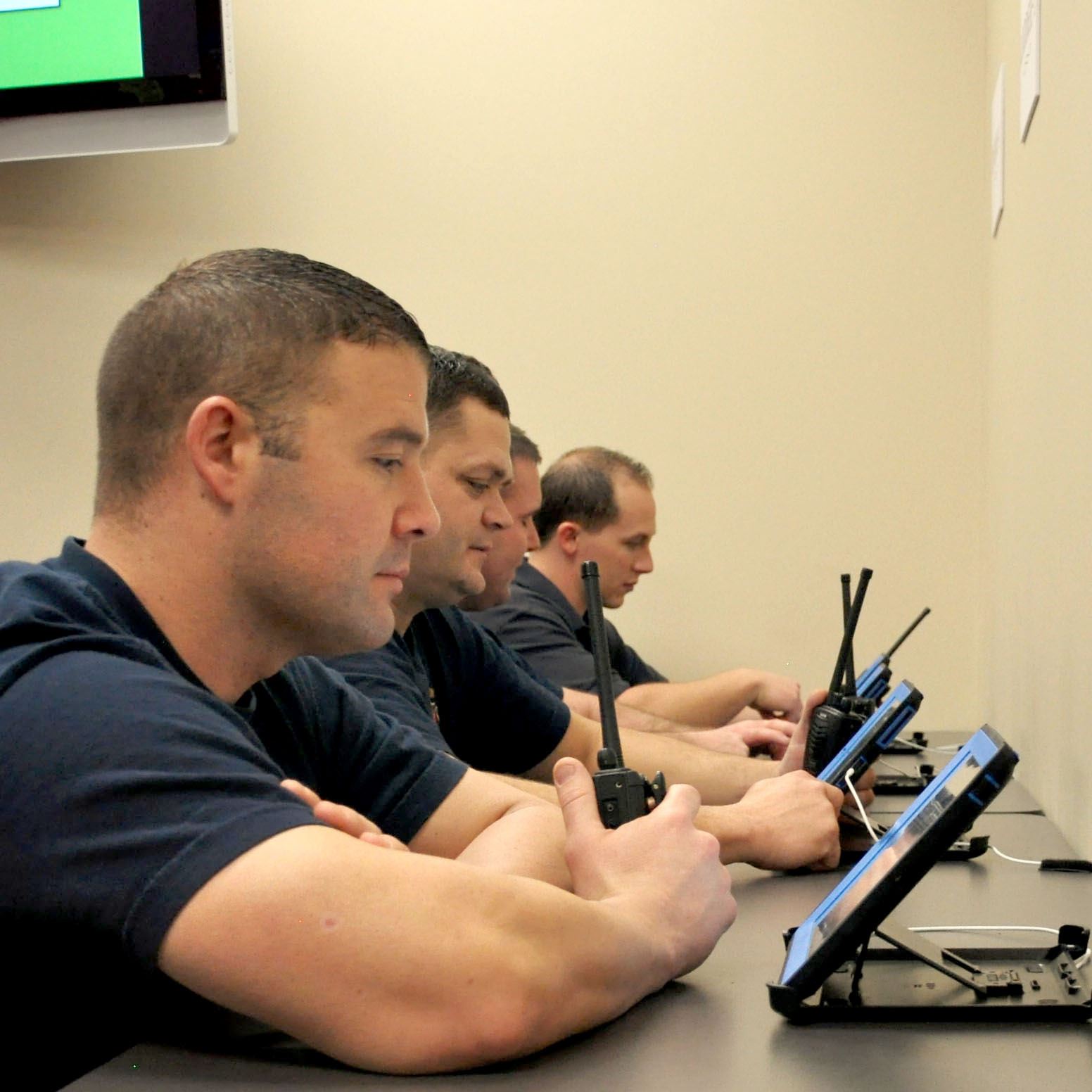 People Sitting Next to Computers